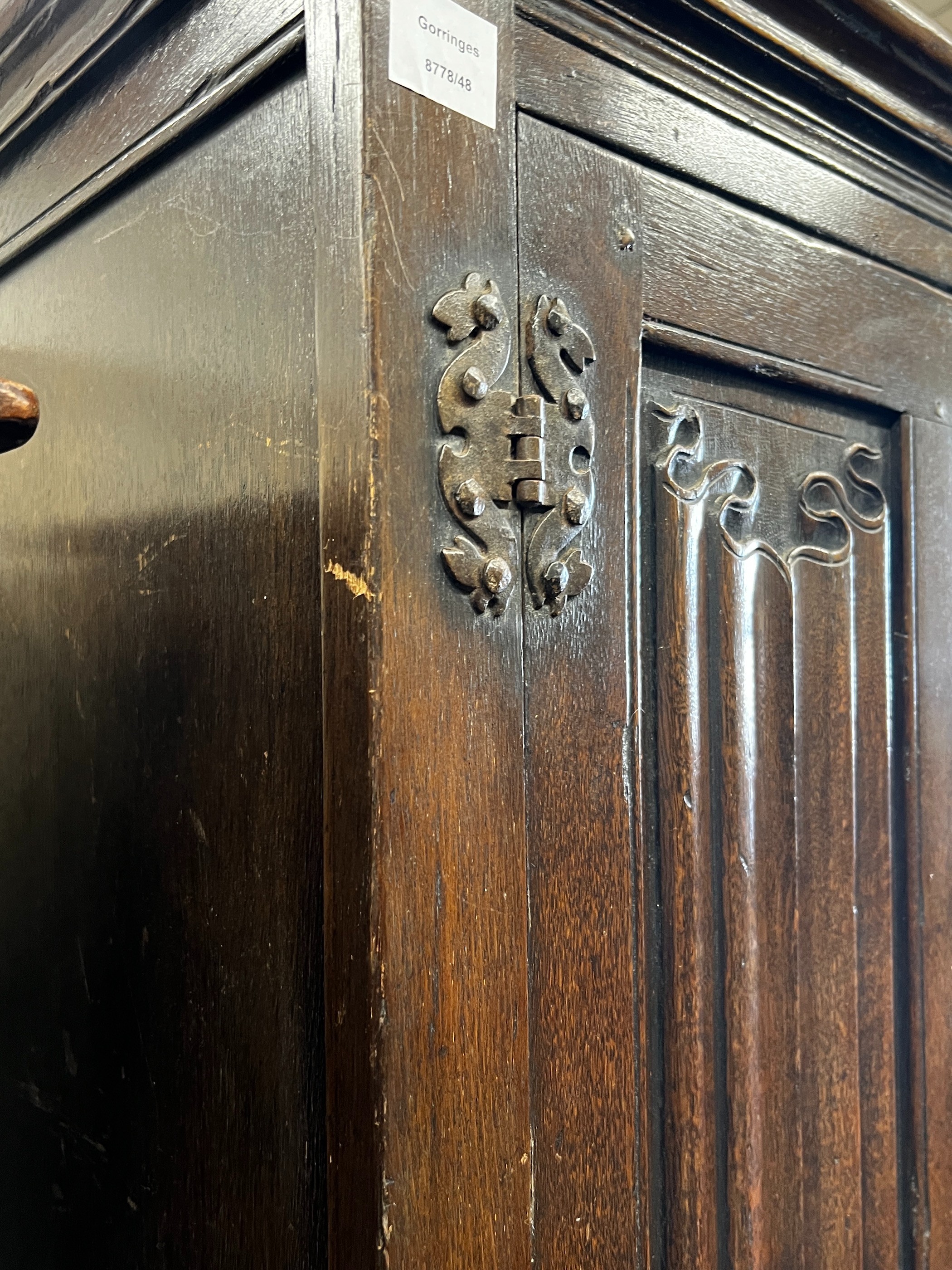 An 18th century style oak linenfold moulded wardrobe, width 123cm, depth 53cm, height 185cm
